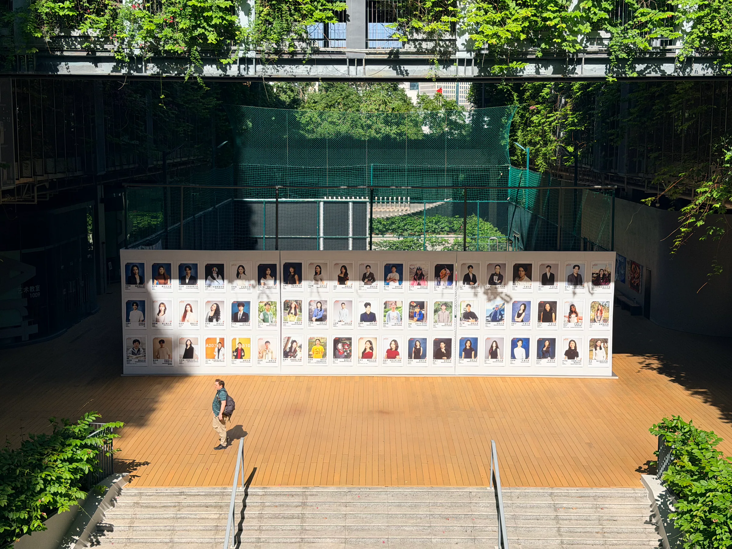 A student portrait display beside the campus steps